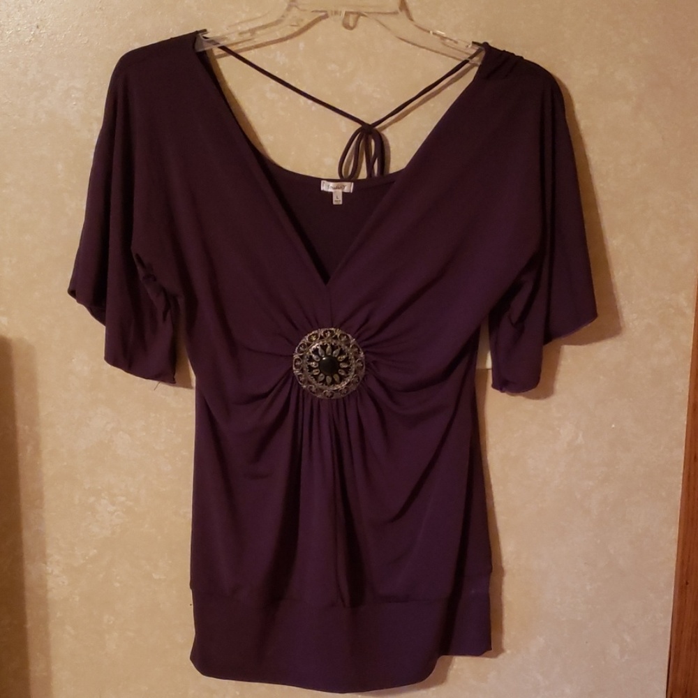 Dark purple blouse with large embellishment